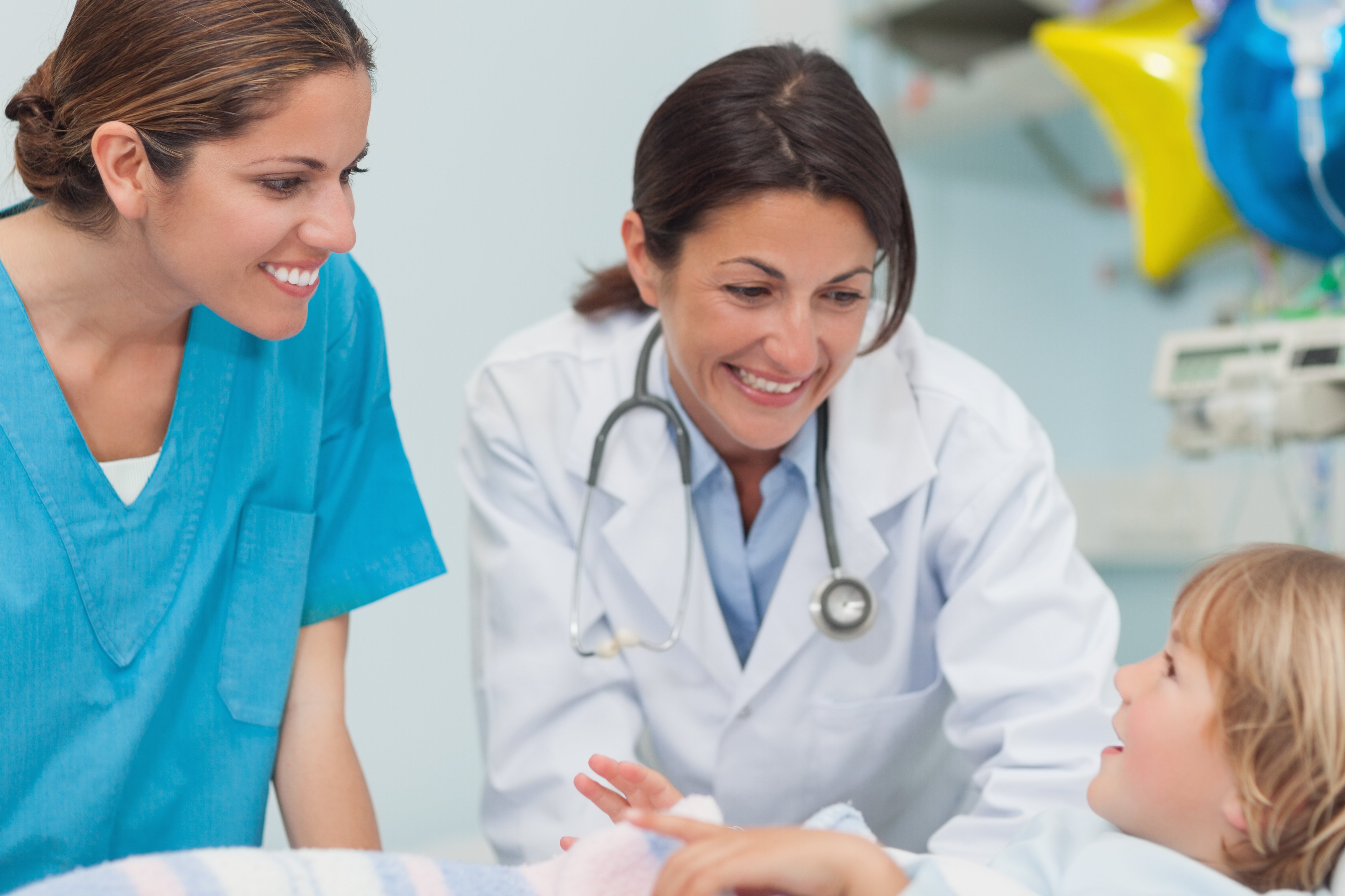 bigstock-Nurse-and-doctor-smiling-to-a--34882004