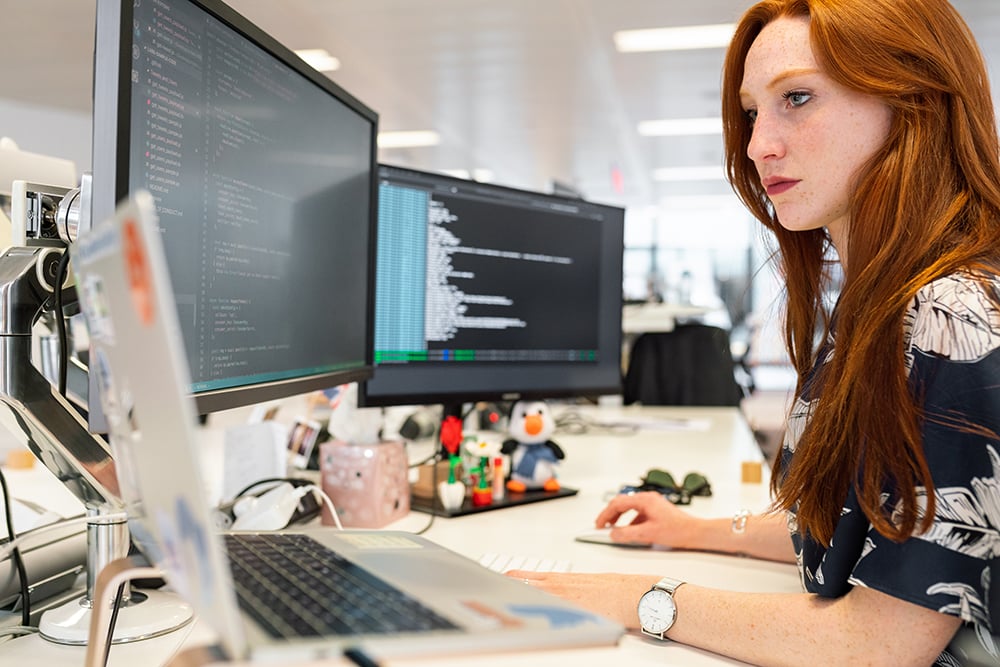 Woman on computer using SaaS in manufacturing